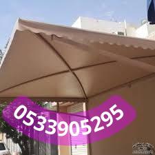 فني تركيب مظلات قماش